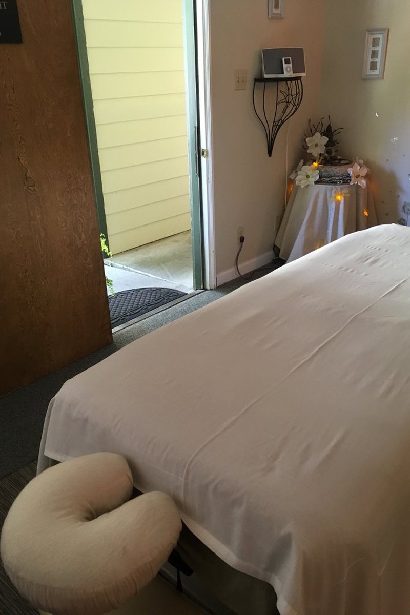 Massage treatment room looking out open door