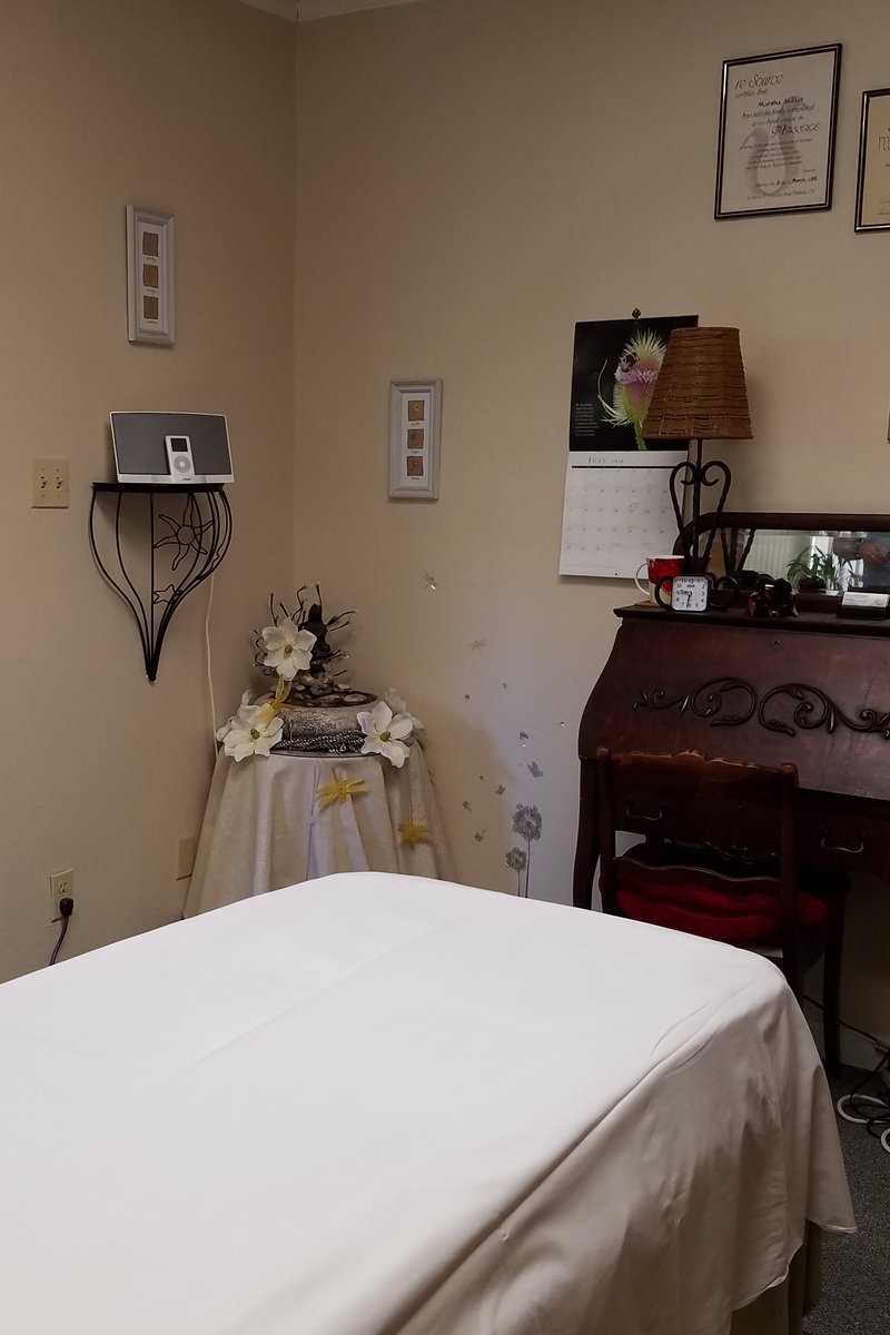 Massage treatment room looking toward tabletop fountain